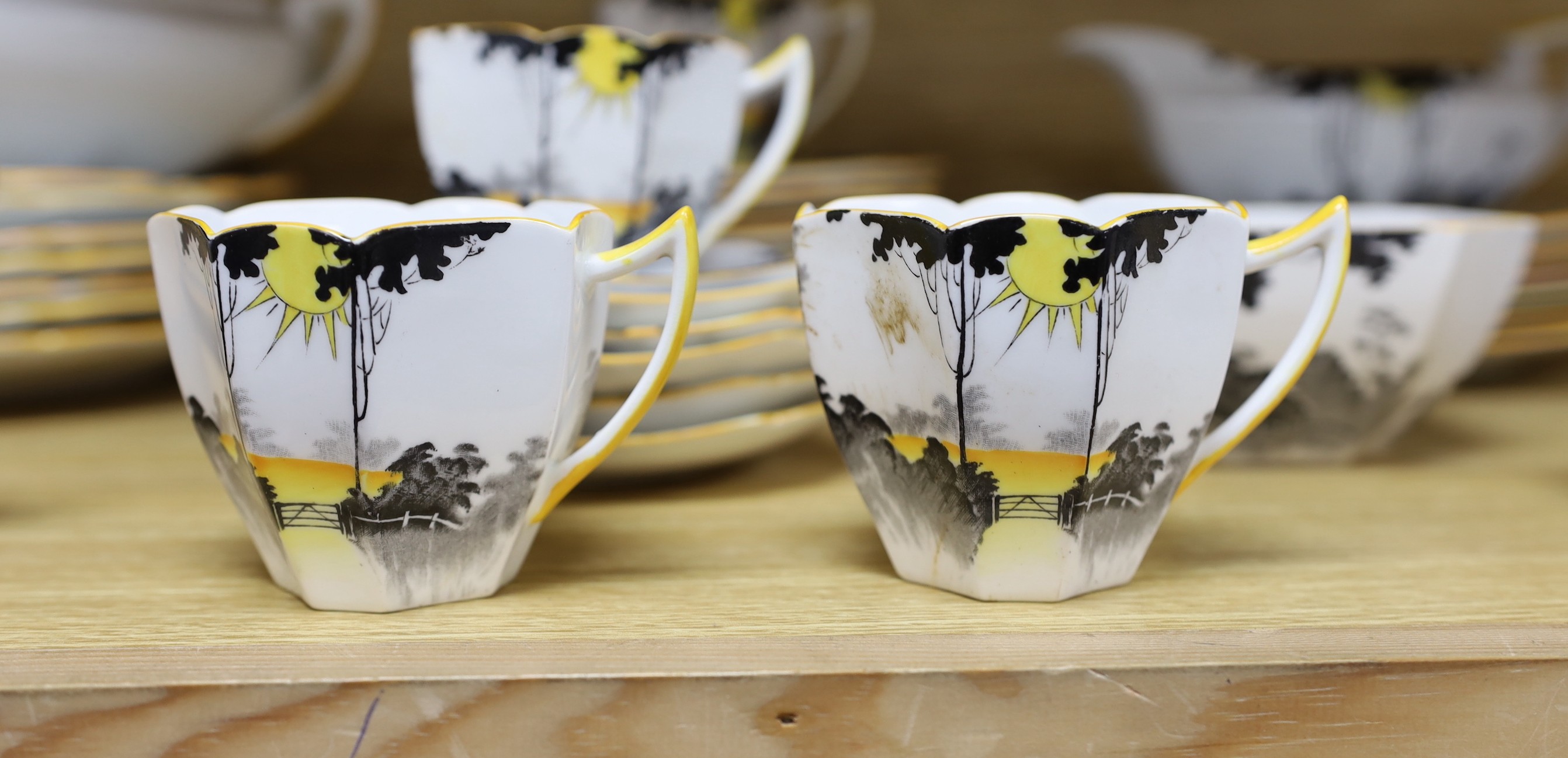 A 1930s Shelley Queen Anne shape Art Deco Sunshine and Tall Trees pattern tea and dinner wares, approx 43 pieces